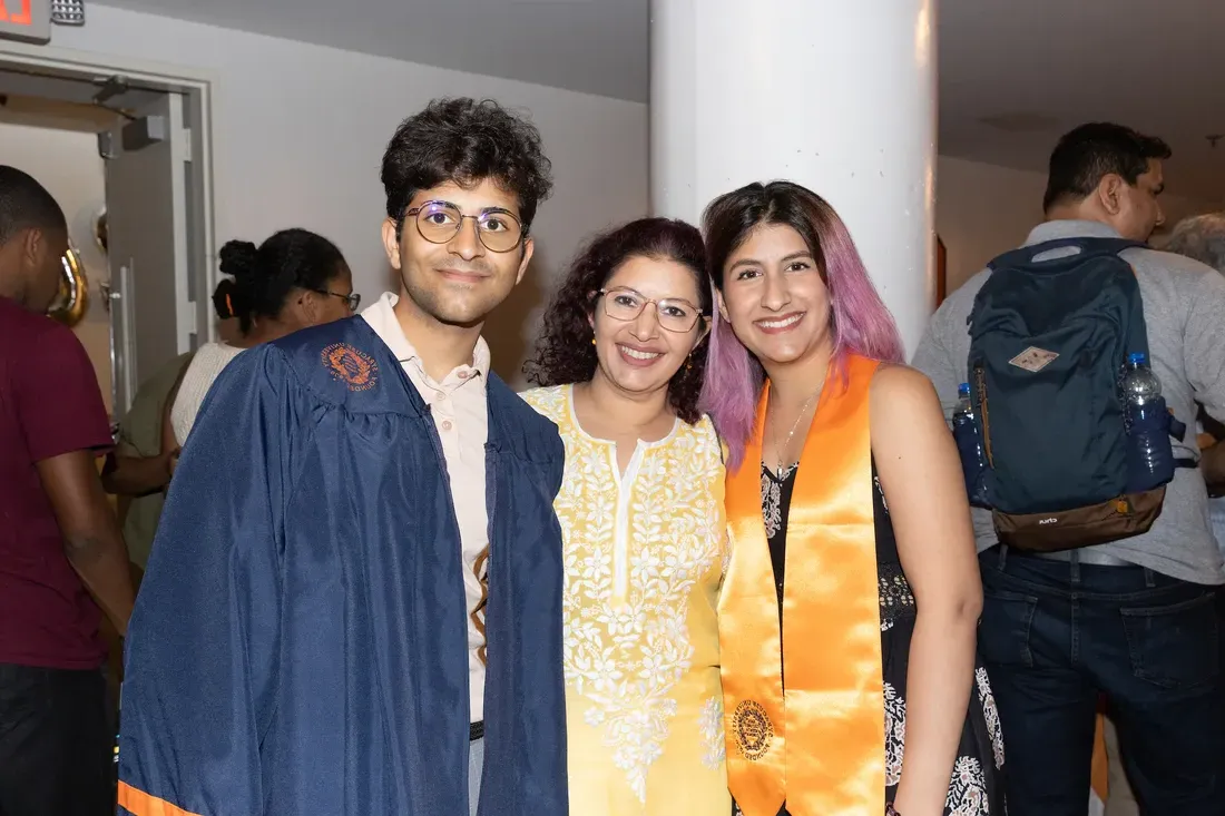 Students smiling at graduation.